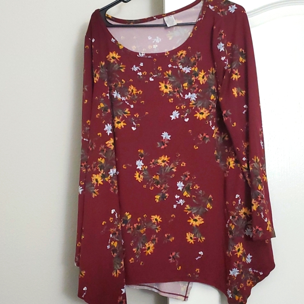 Long sleeve burgundy shirt with handkerchief hem.